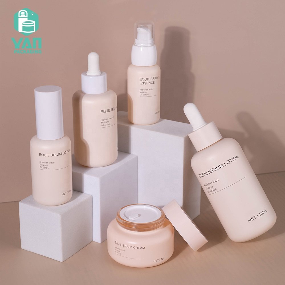 YAN Packaging fancy matte pink color european luxury skincare packaging set dropper pump glass bottle jar
