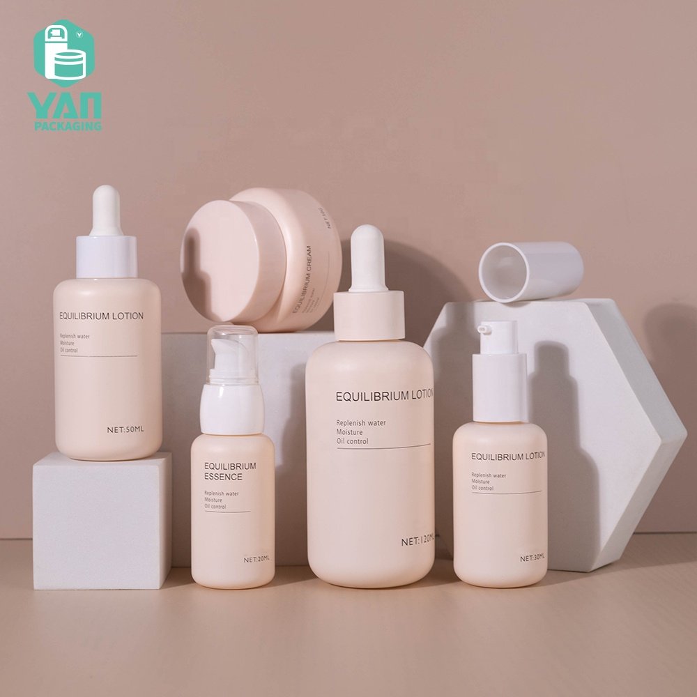 YAN Packaging fancy matte pink color european luxury skincare packaging set dropper pump glass bottle jar