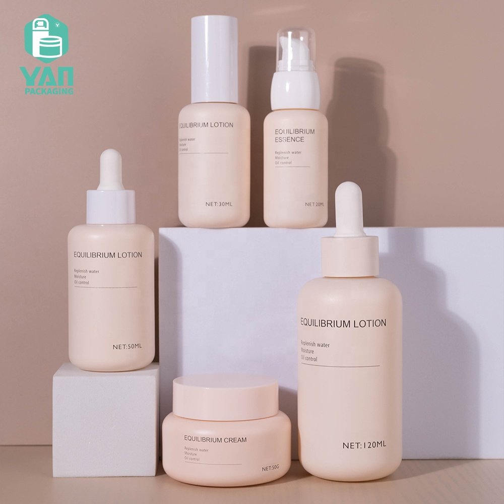 YAN Packaging fancy matte pink color european luxury skincare packaging set dropper pump glass bottle jar