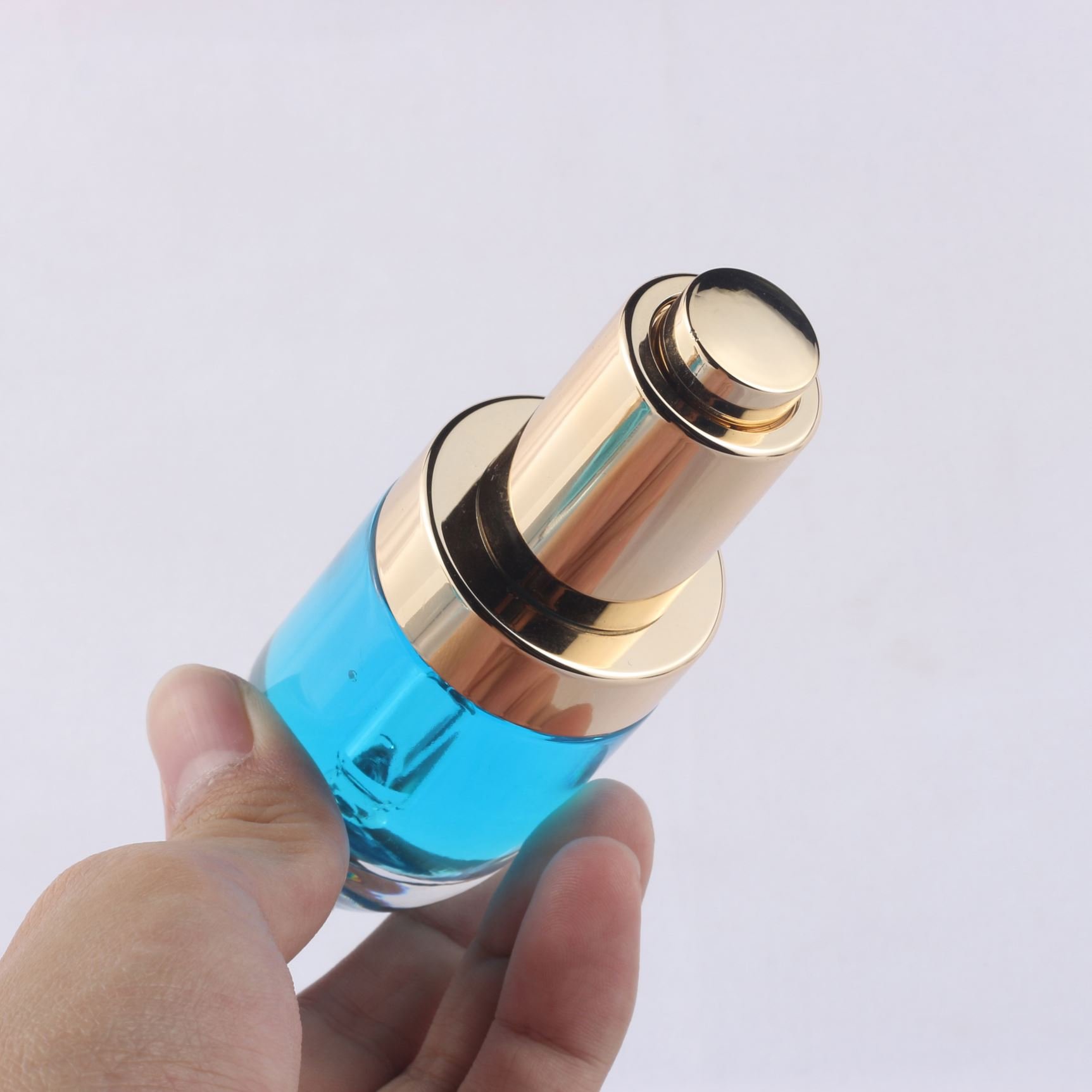 Low price thick walled press button transparent dropper bottle 1oz 30ml skincare serum glass bottle packaging