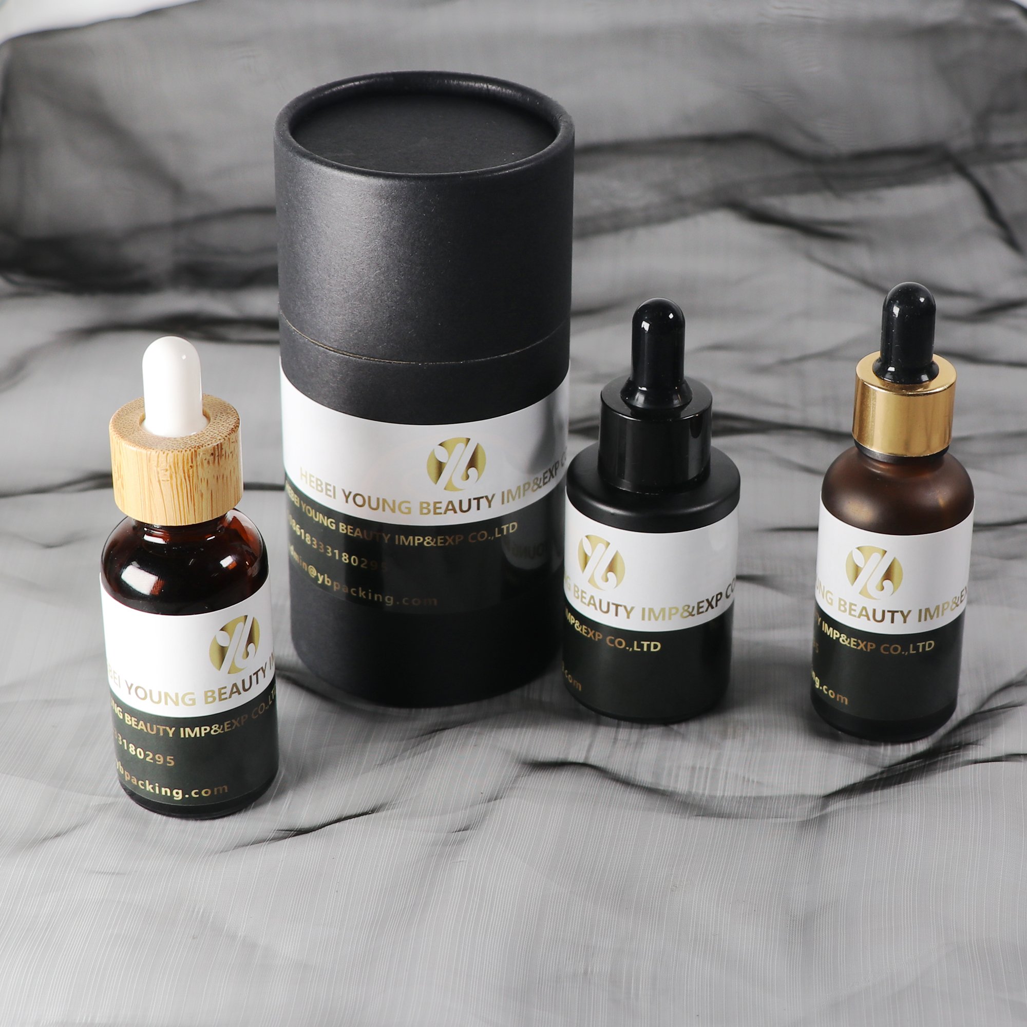 Customized Luxury 30ml black matte essential oil glass bottle with dropper label and printing glossy black lid flat shoulder