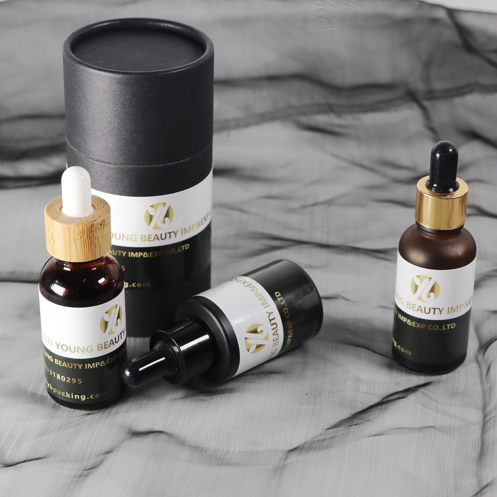 Customized Luxury 30ml black matte essential oil glass bottle with dropper label and printing glossy black lid flat shoulder