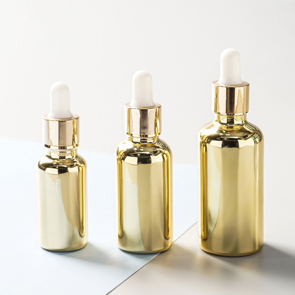 Factory Supply 30ml 50ml Electroplating Sub-packing Small Gold Bottle Gold-plated Dropper Essential Oil Glass Bottle