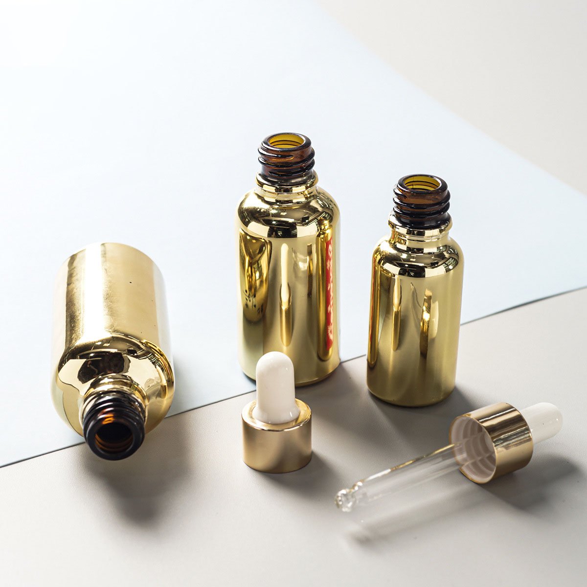 Factory Supply 30ml 50ml Electroplating Sub-packing Small Gold Bottle Gold-plated Dropper Essential Oil Glass Bottle