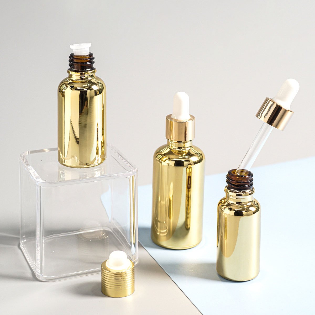 Factory Supply 30ml 50ml Electroplating Sub-packing Small Gold Bottle Gold-plated Dropper Essential Oil Glass Bottle