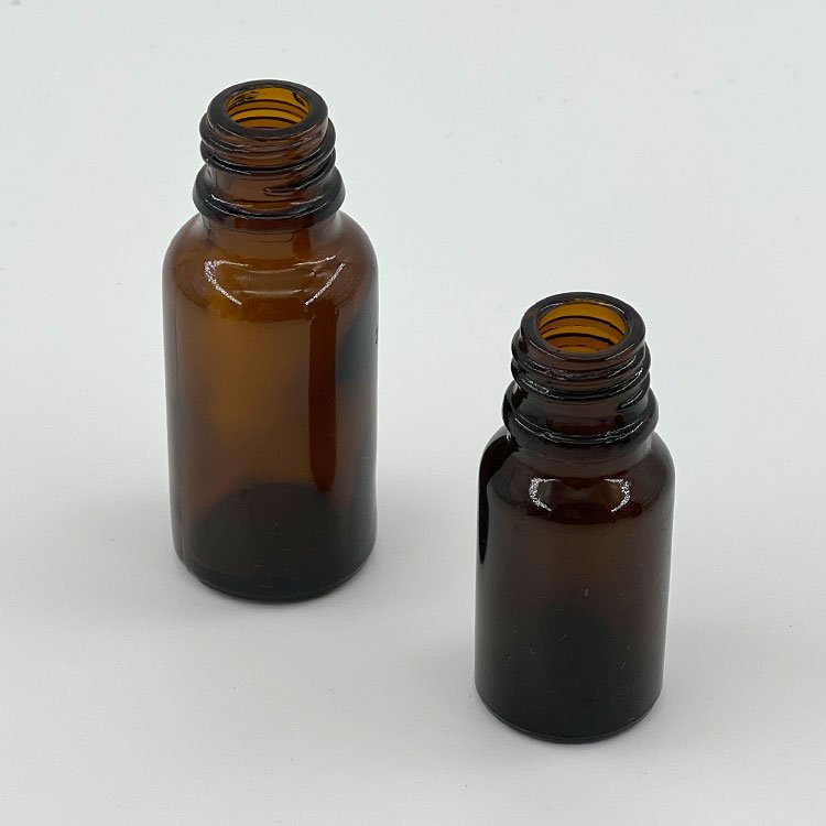 Wholesale custom 10ml 15ml 30ml 100ml amber round serum bottle glass essential oil bottle with dropper