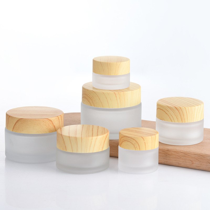 Ready to ship cosmetic frosted glass jar wholesale 20ml 30ml 50ml matte frosted container with wooden bamboo lid