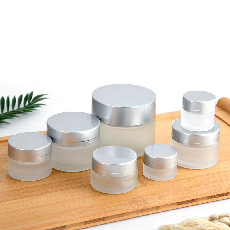 Ready to ship cosmetic frosted glass jar wholesale 20ml 30ml 50ml matte frosted container with wooden bamboo lid