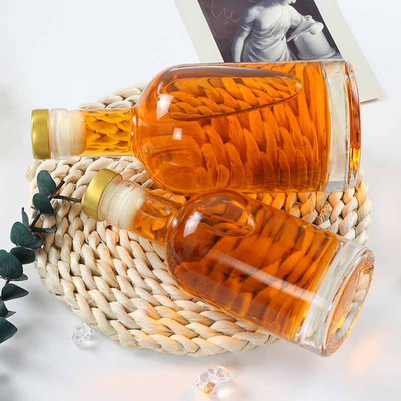 wholesale 500ml 700ml 750ml 1 liter round bottles glass empty gin vodka whiskey glass liquor bottle gin glass bottle with lid