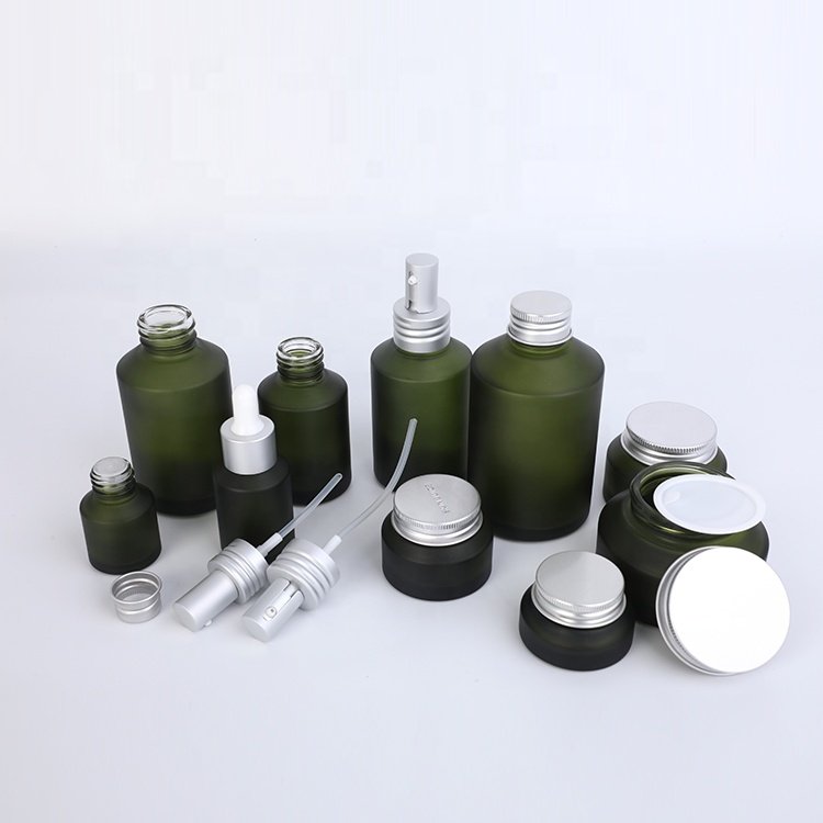 unique design slanted shoulder recyclable olive green cosmetic glass bottles and jars with mental aluminum lid for skin care