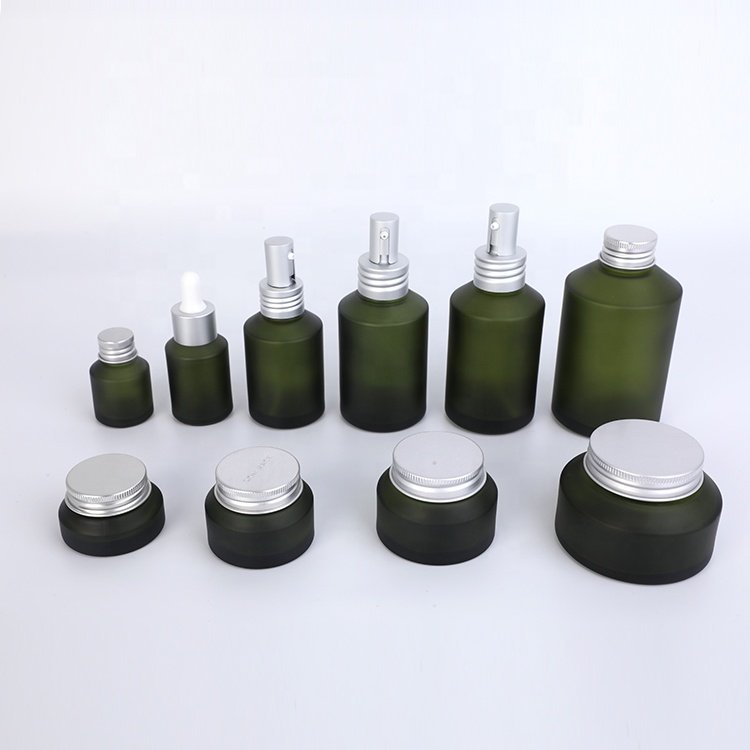 unique design slanted shoulder recyclable olive green cosmetic glass bottles and jars with mental aluminum lid for skin care
