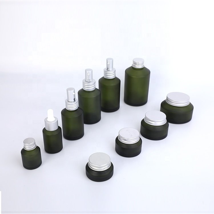 unique design slanted shoulder recyclable olive green cosmetic glass bottles and jars with mental aluminum lid for skin care