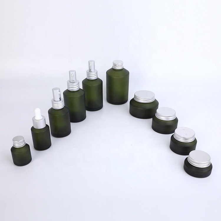 unique design slanted shoulder recyclable olive green cosmetic glass bottles and jars with mental aluminum lid for skin care