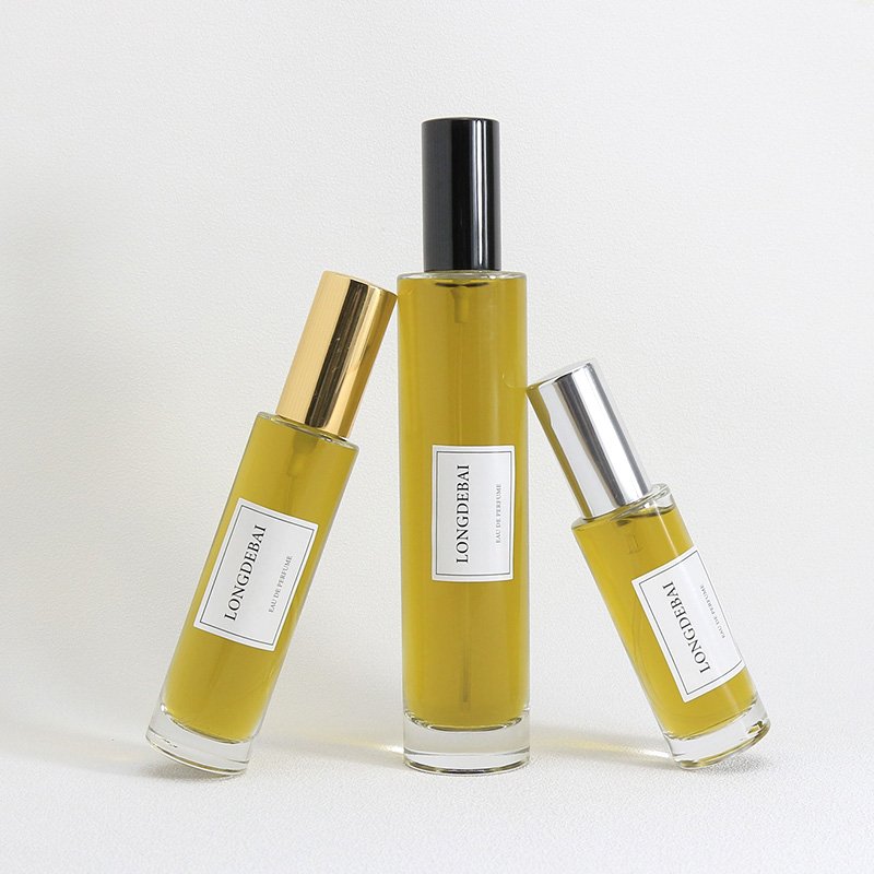LONGDEBAI Luxury empty round cylinder glass bottle 30ml 50ml 100ml refillable perfume bottles with screw spray cap