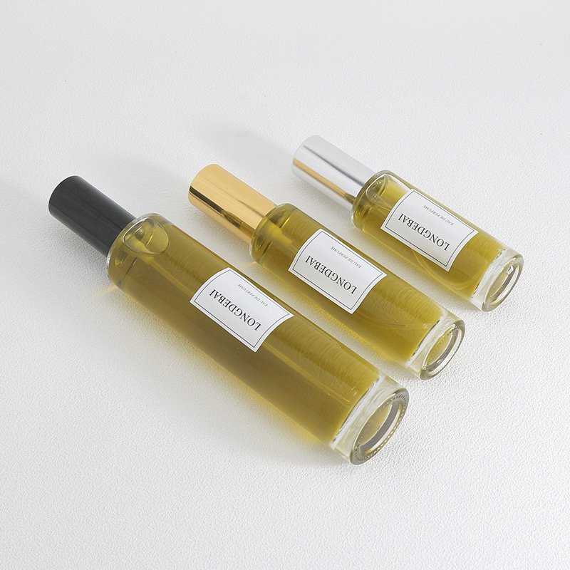 LONGDEBAI Luxury empty round cylinder glass bottle 30ml 50ml 100ml refillable perfume bottles with screw spray cap