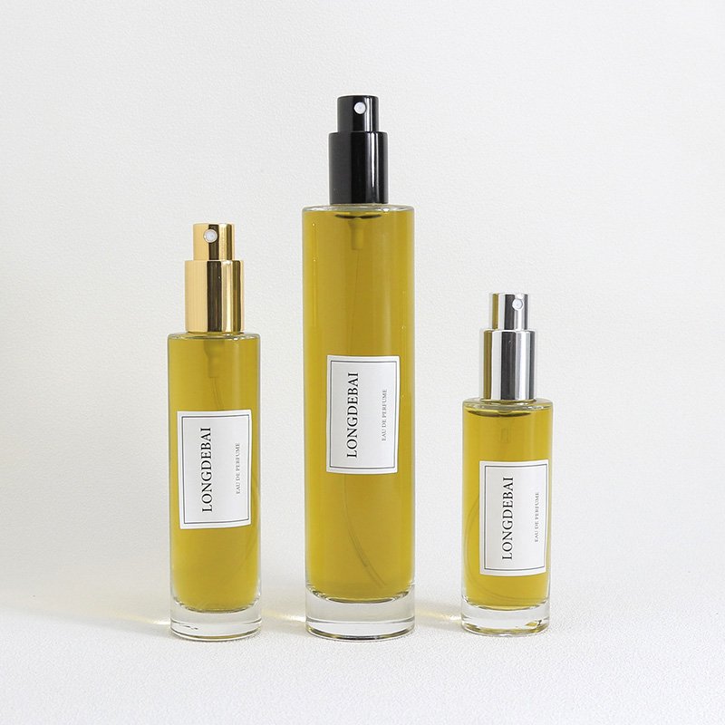 LONGDEBAI Luxury empty round cylinder glass bottle 30ml 50ml 100ml refillable perfume bottles with screw spray cap