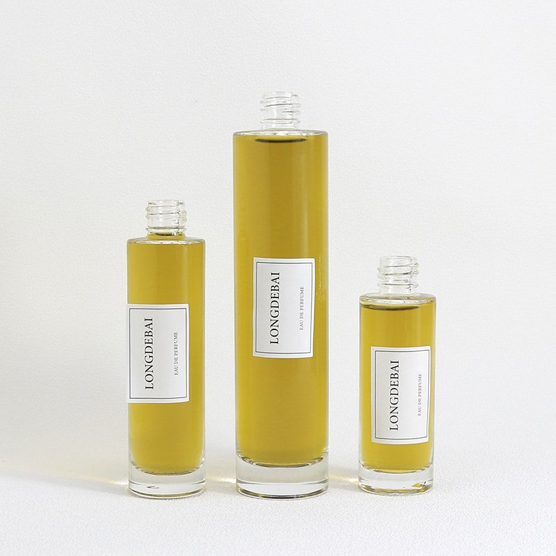 LONGDEBAI Luxury empty round cylinder glass bottle 30ml 50ml 100ml refillable perfume bottles with screw spray cap