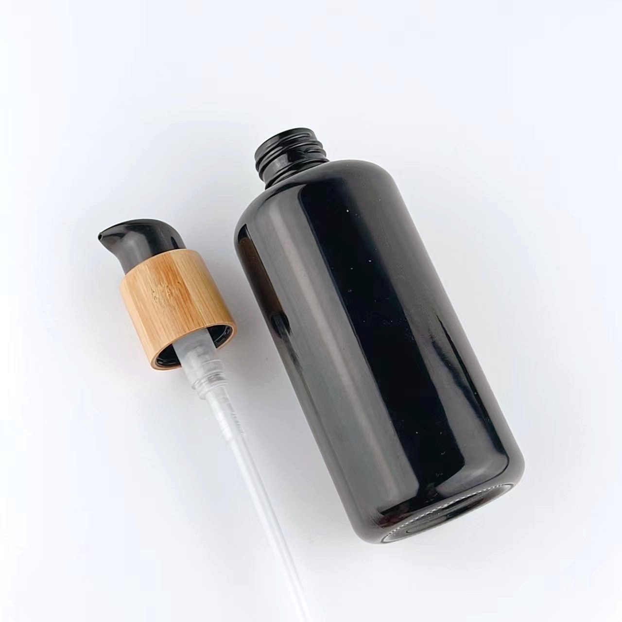 200 ml black glass bottle serum pump bottle empty cosmetic bottle with bamboo pump 24/410 switch pump for cosmetic packaging