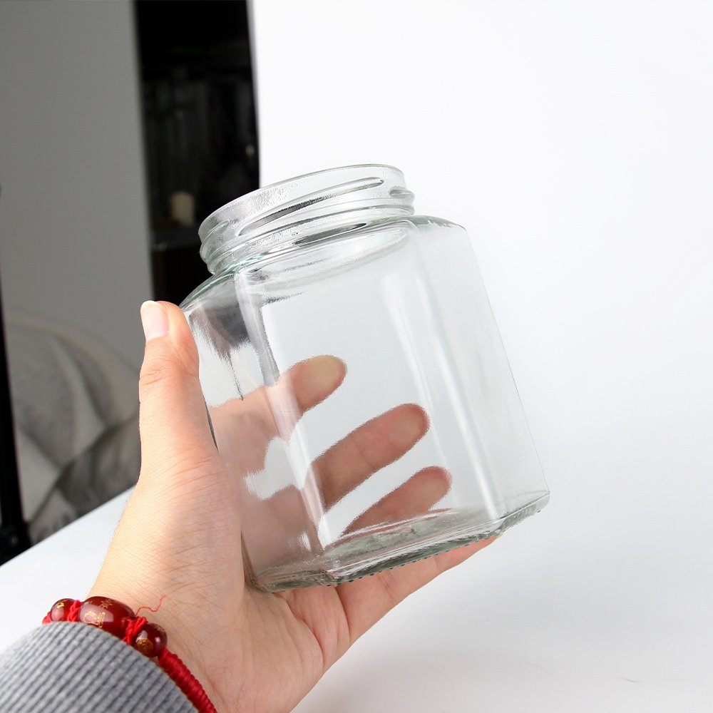 Hot selling glass jar honey jar food small jar packaging container hexagonal with metal screw lid