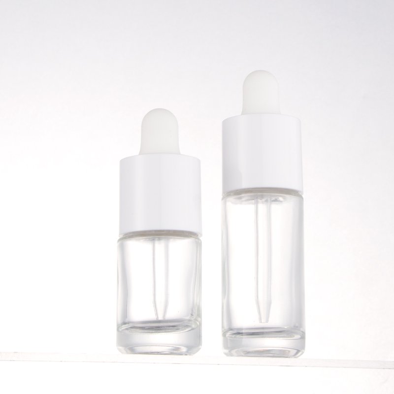 Fancy round cylinder empty glass bottles 20ml 30ml cosmetic serum essential oil dropper bottle with new design lid