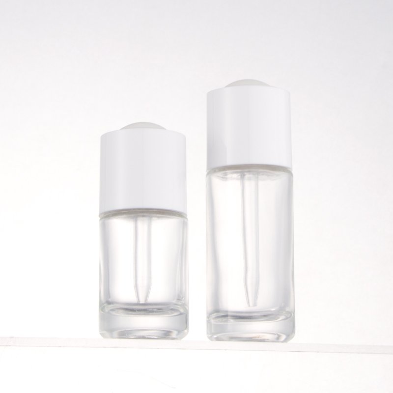 Fancy round cylinder empty glass bottles 20ml 30ml cosmetic serum essential oil dropper bottle with new design lid