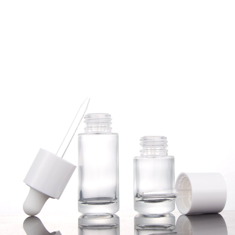 Fancy round cylinder empty glass bottles 20ml 30ml cosmetic serum essential oil dropper bottle with new design lid