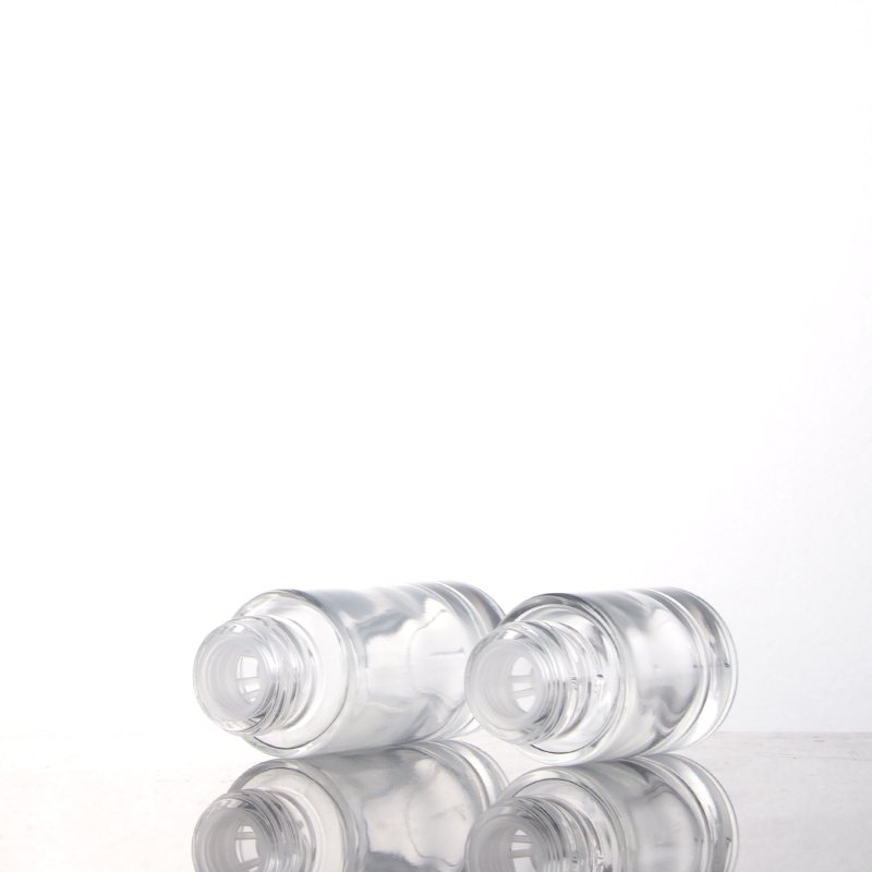 Fancy round cylinder empty glass bottles 20ml 30ml cosmetic serum essential oil dropper bottle with new design lid