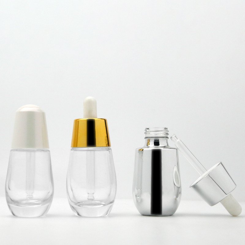 Luxury electroplated 30ml clear glossy white and gold drop shape thick base 50 ml serum dropper bottles silver top