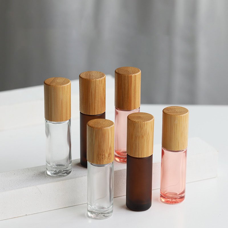 Hot selling 5ml 10ml bamboo roll on glass bottle frosted amber roll on perfume bottle for essential oil