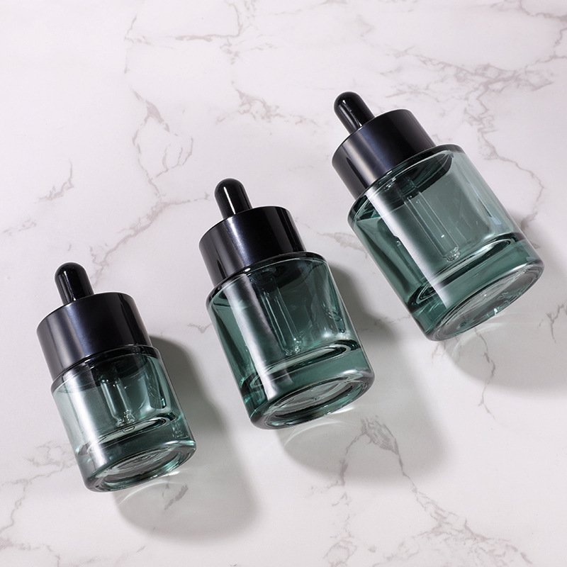 Wholesale Dark Green Oil Dropper Bottle 15ml 20ml 30ml 40ml 50ml Flat Shoulder Round Serum Glass Bottles With Dropper Cap