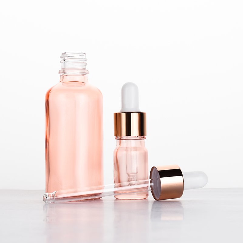 Luxury 0.5oz 1oz 2 oz 10ml 15ml 20ml 30ml 50ml 100ml pink essential oil facial serum glass dropper bottle with rose gold caps