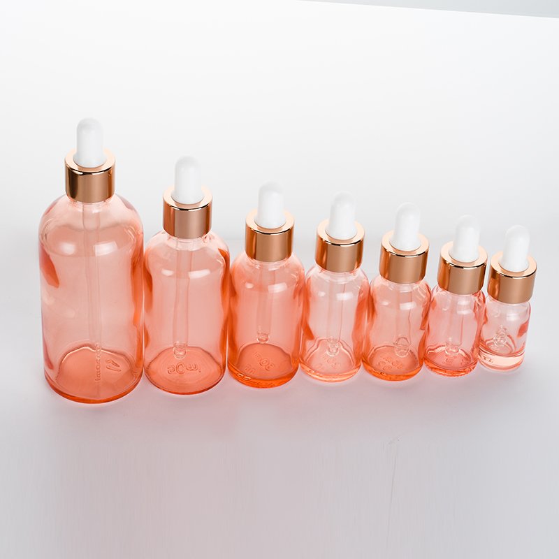 Luxury 0.5oz 1oz 2 oz 10ml 15ml 20ml 30ml 50ml 100ml pink essential oil facial serum glass dropper bottle with rose gold caps