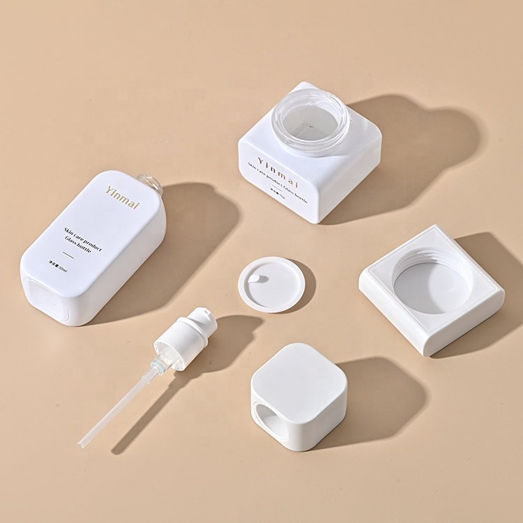 Yinmai 30 50 100 120ml 30G 50G custom empty luxury thick bottom skincare packaging set glass cosmetic pump bottle and cream jar