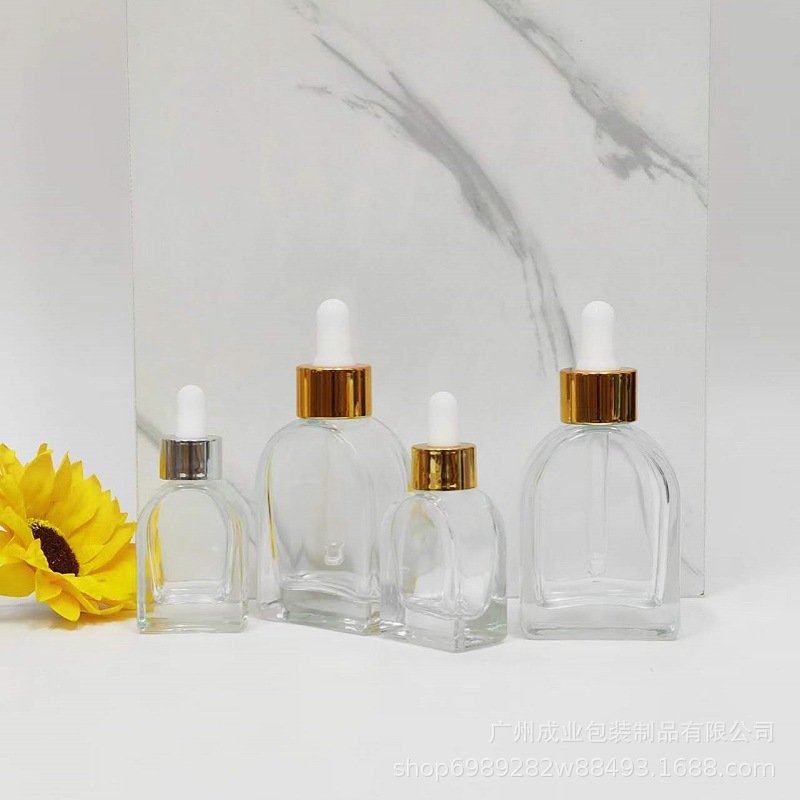 30ml clear cosmetic packaging empty glass bottle oblate vaulted shape Korean skincare liquid dropper bottle for hair perfume oil