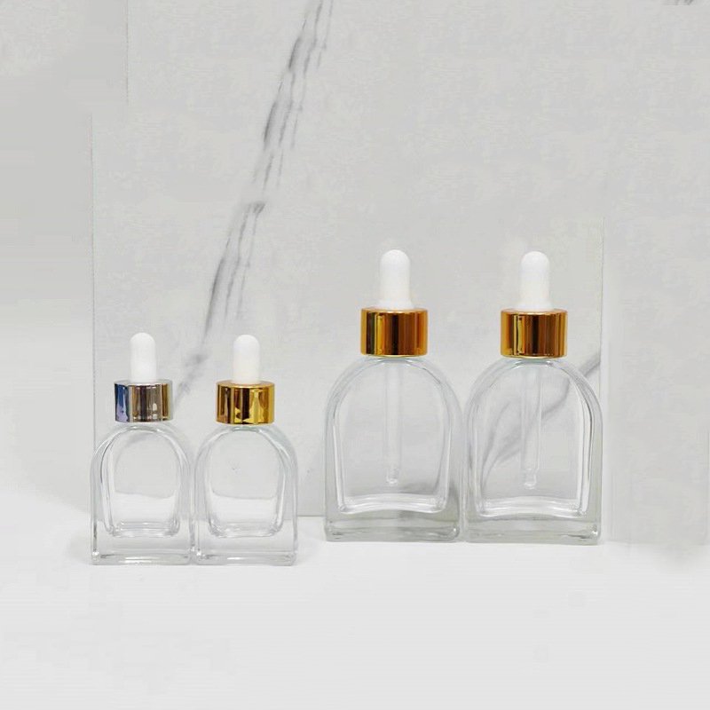 30ml clear cosmetic packaging empty glass bottle oblate vaulted shape Korean skincare liquid dropper bottle for hair perfume oil