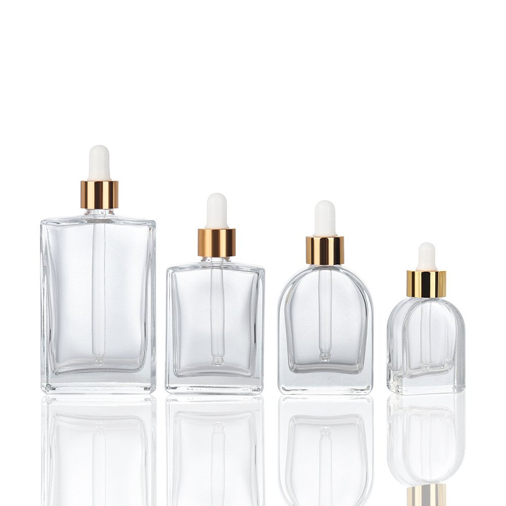 30ml clear cosmetic packaging empty glass bottle oblate vaulted shape Korean skincare liquid dropper bottle for hair perfume oil