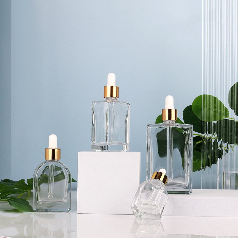30ml clear cosmetic packaging empty glass bottle oblate vaulted shape Korean skincare liquid dropper bottle for hair perfume oil