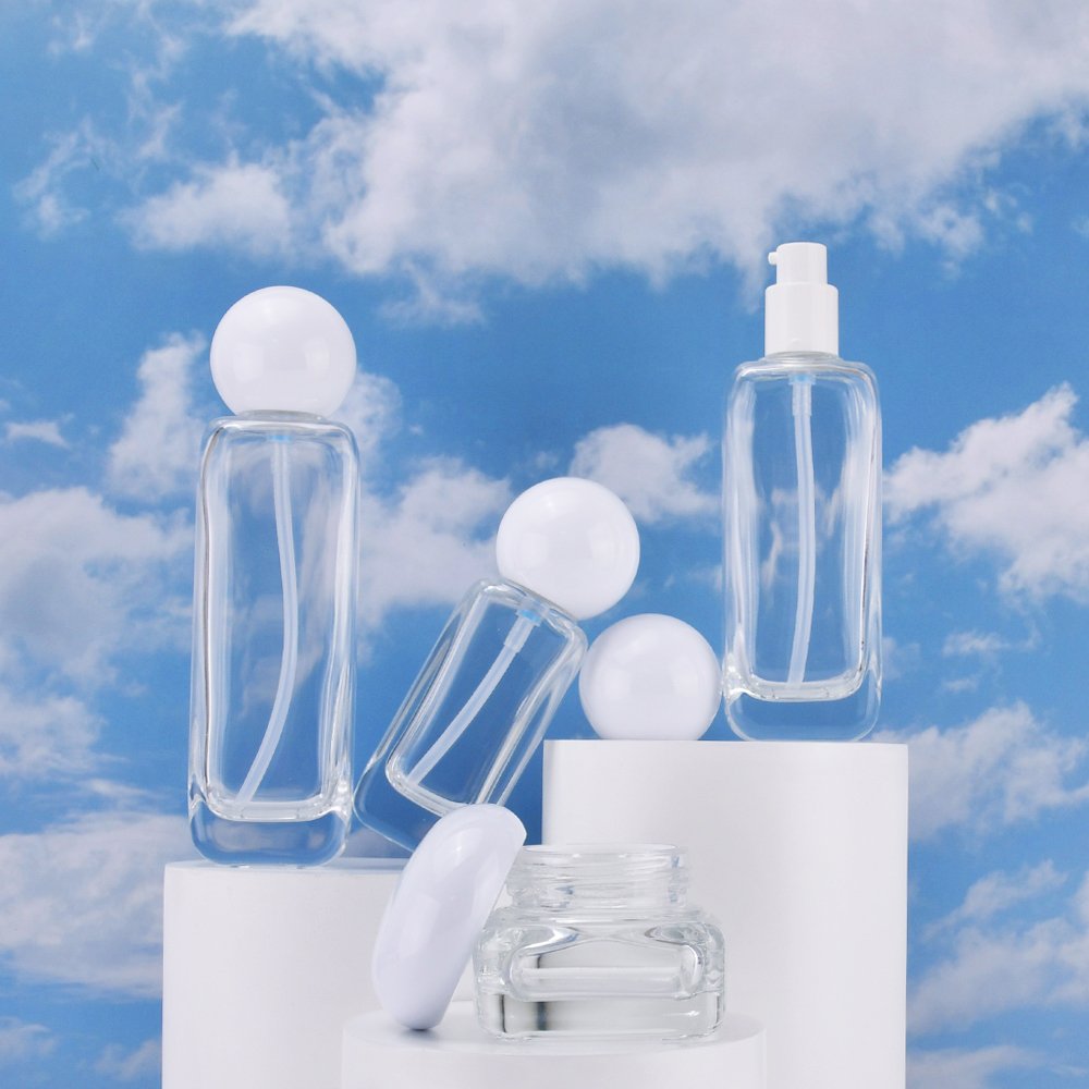2014 New luxury cosmetic packaging glass bottle set 50g 40ml 50ml 100ml 120ml skincare cream jar and serum pump spray bottle set