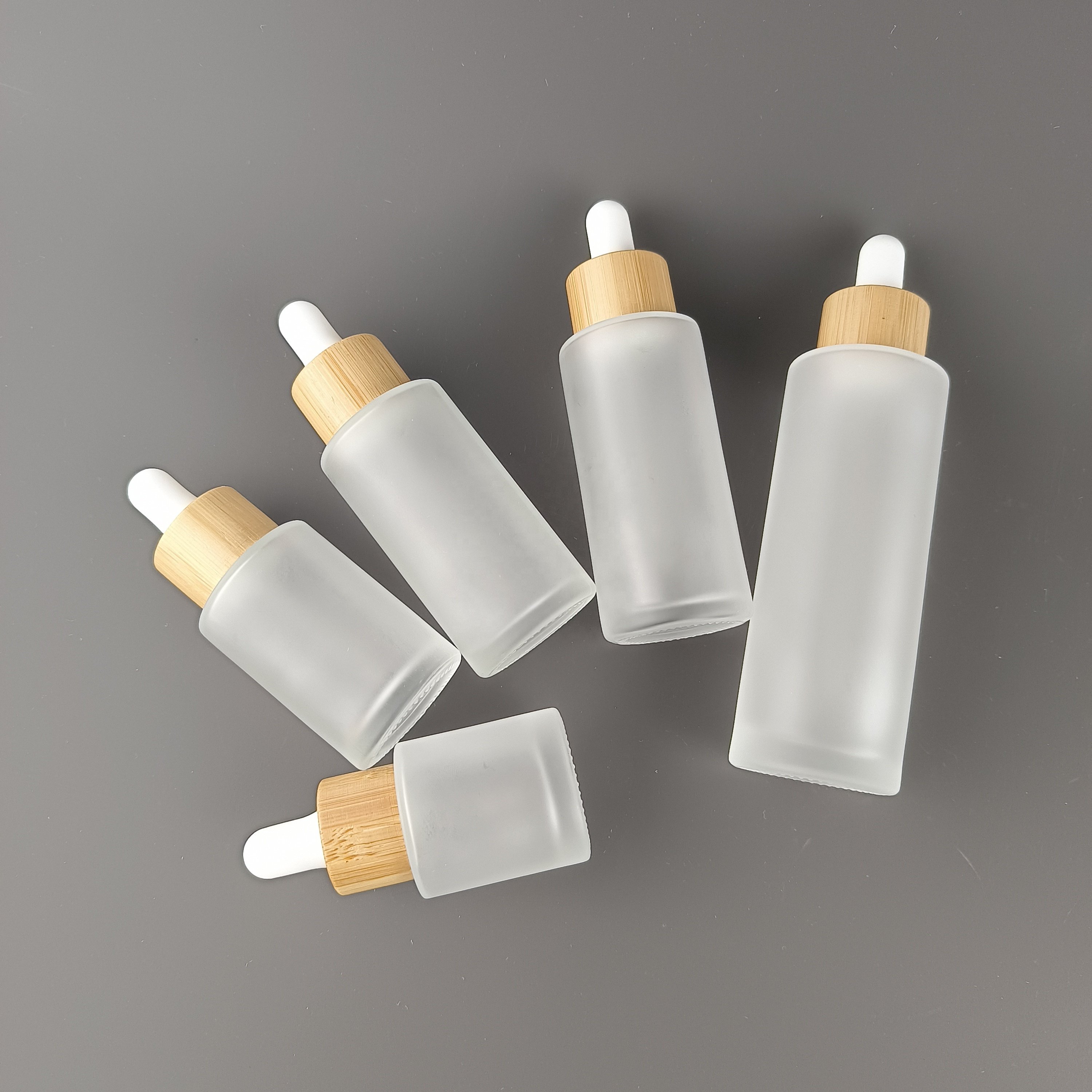 Flat shoulder glass bottle 30 ml 40 ml 50 ml 60 ml 100ml 120ml 150ml frosted glass bottle with bamboo spray pump