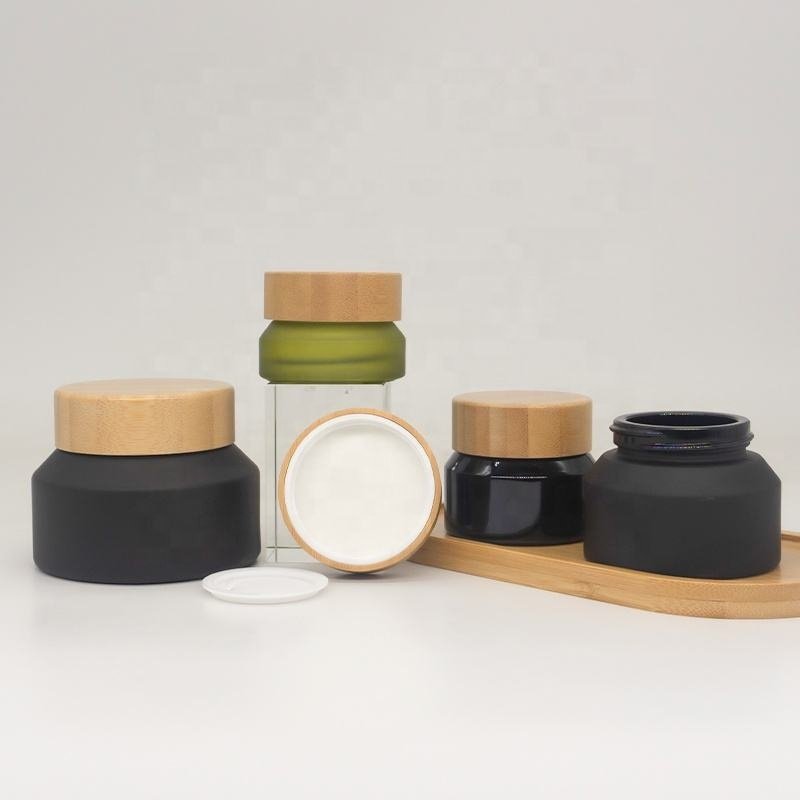 Cosmetic packaging slant shoulder matte black skin care set glass bottle cosmetic products with black dropper and jar with lid