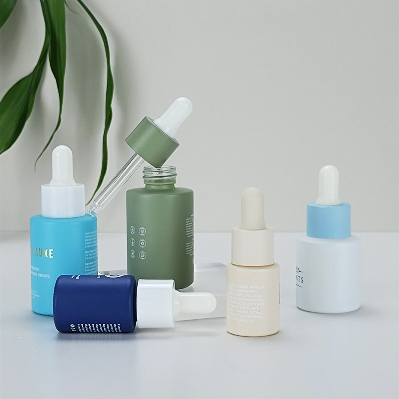 Custom 30ml 50ml 100ml cosmetic packaging serum oil container essential oil glass dropper bottle