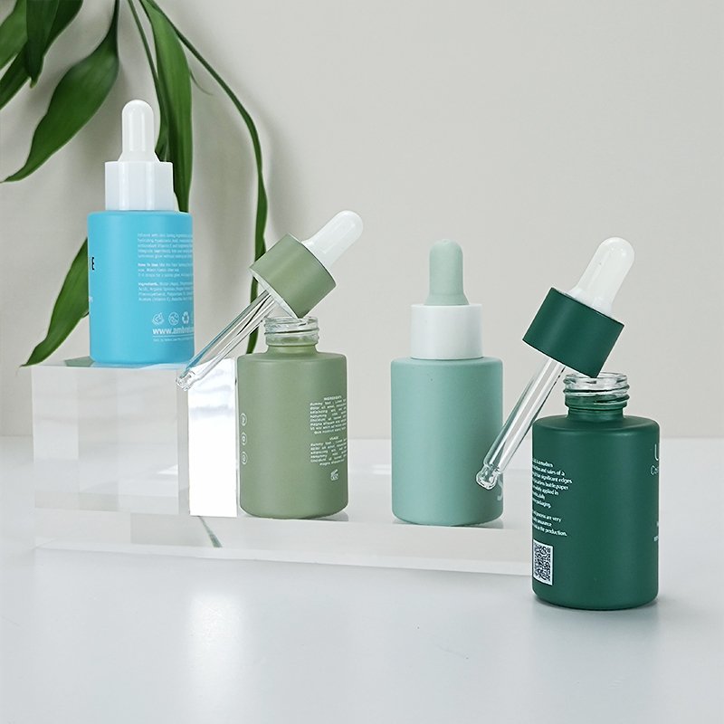 Custom 30ml 50ml 100ml cosmetic packaging serum oil container essential oil glass dropper bottle