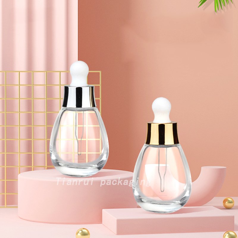 Wholesale OEM ODM Skincare Clear Essential Oil Dropper Bottle 30ml Cute Glass Round Serum Dropper Bottle Packaging