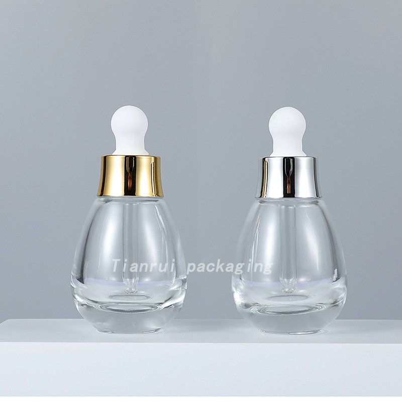 Wholesale OEM ODM Skincare Clear Essential Oil Dropper Bottle 30ml Cute Glass Round Serum Dropper Bottle Packaging