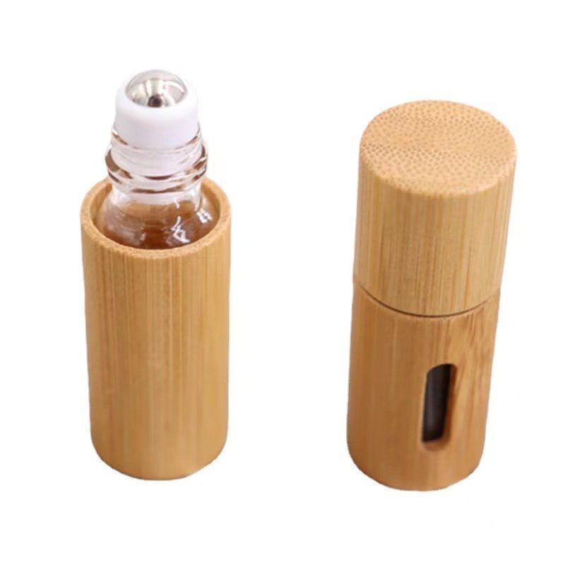 Wholesale New Products Engraving Logo 100% Organic Bamboo Cosmetic Packaging Beautiful Bamboo Roll On Bottle Empty Glass Tube