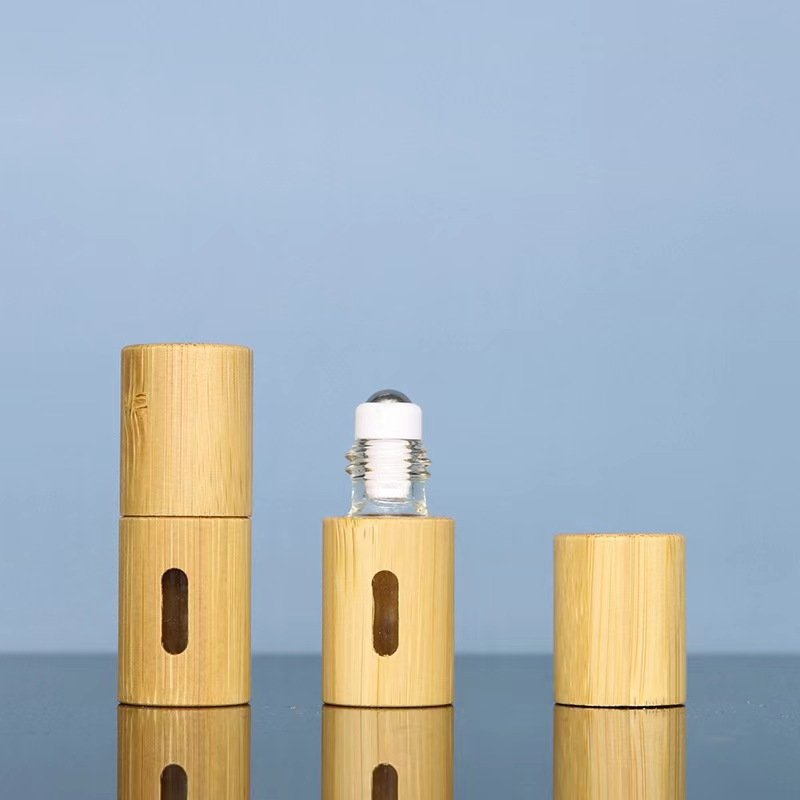 Wholesale New Products Engraving Logo 100% Organic Bamboo Cosmetic Packaging Beautiful Bamboo Roll On Bottle Empty Glass Tube