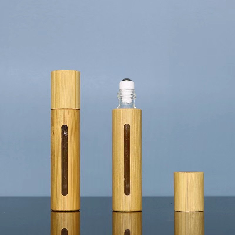 Wholesale New Products Engraving Logo 100% Organic Bamboo Cosmetic Packaging Beautiful Bamboo Roll On Bottle Empty Glass Tube
