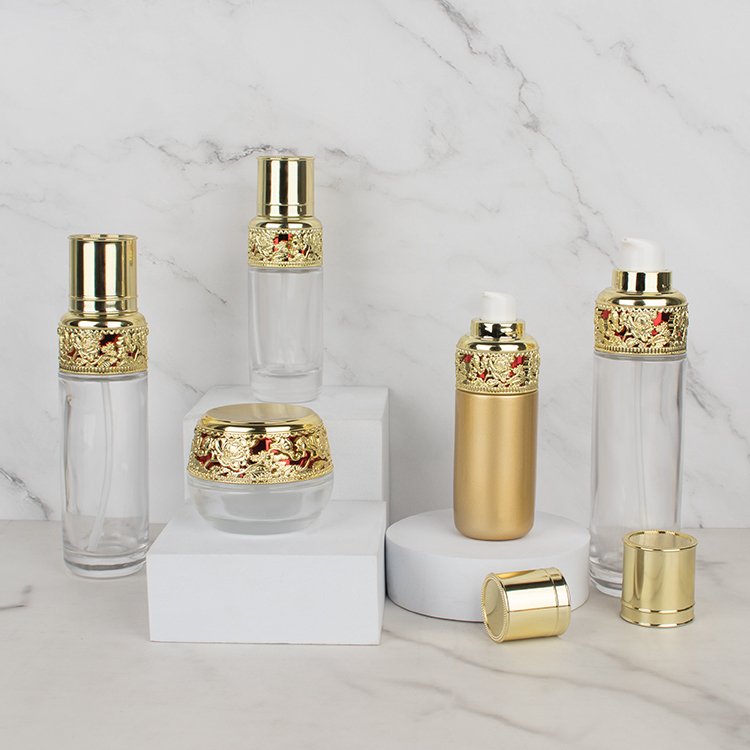 luxury golden glass bottle sets cosmetic skincare container packaging glass cream jar with sophestication gold cap