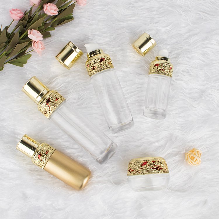 luxury golden glass bottle sets cosmetic skincare container packaging glass cream jar with sophestication gold cap