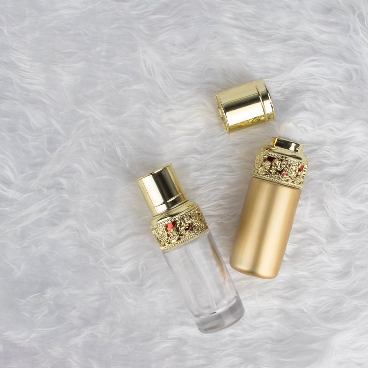 luxury golden glass bottle sets cosmetic skincare container packaging glass cream jar with sophestication gold cap